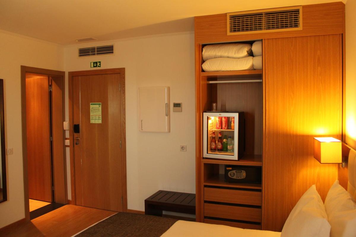 Uma cama ou camas num quarto em Hotel O Gato & Spa