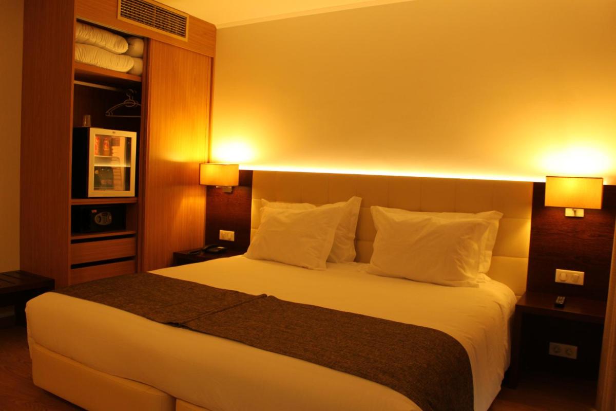 Uma cama ou camas num quarto em Hotel O Gato & Spa