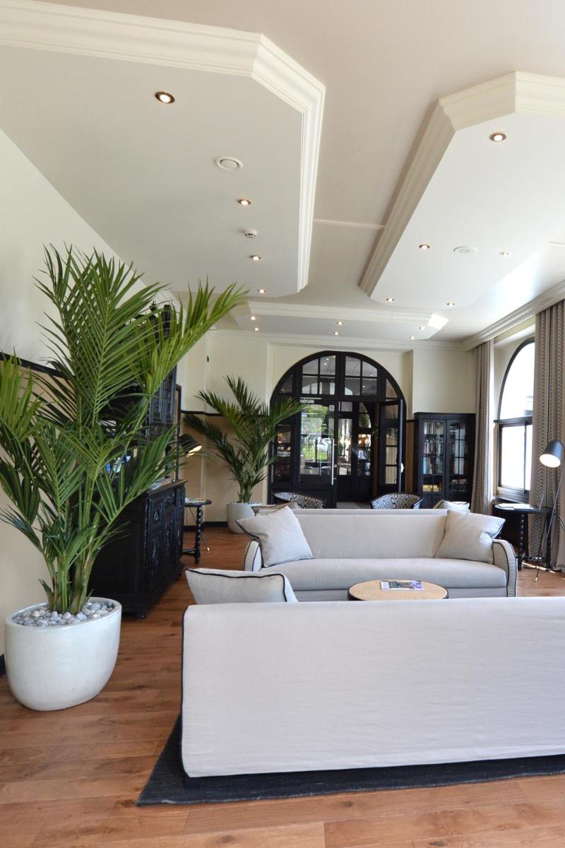 Coin salon dans l'établissement Hotel De Diane