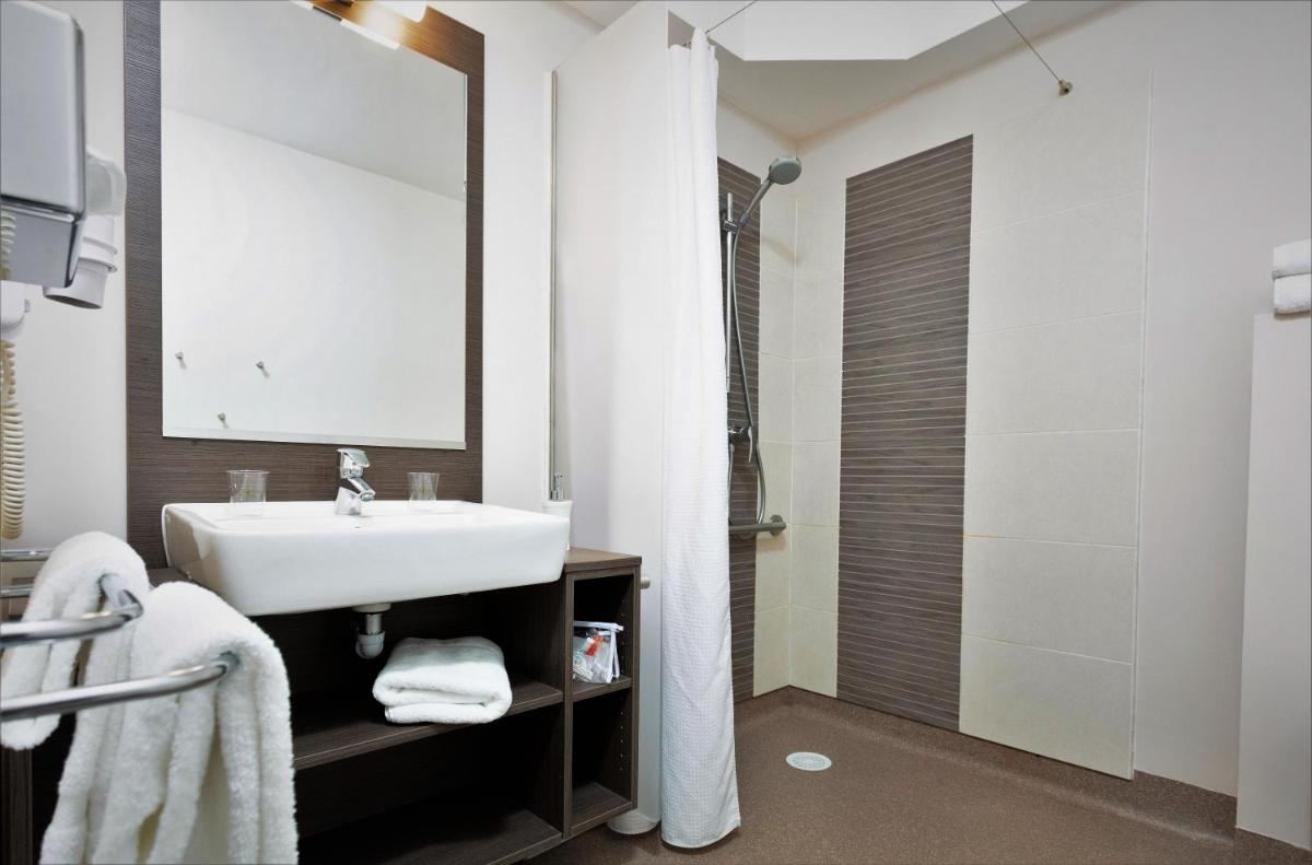 Salle de bains dans l'établissement Forme-hotel & Spa Montpellier Sud-Est - Parc Expositions - Arena