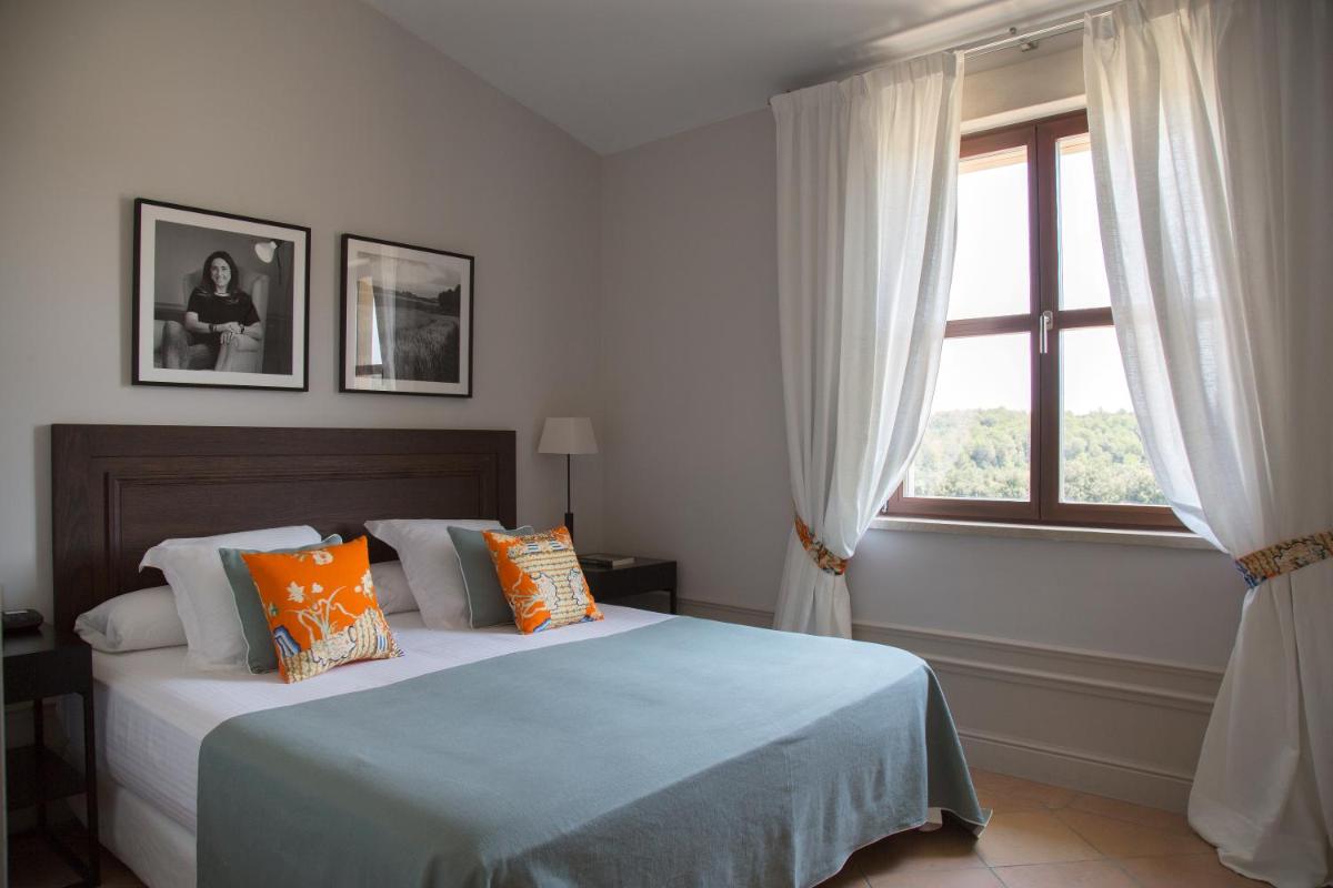 Cama o camas de una habitación en Casa Anamaria Hotel