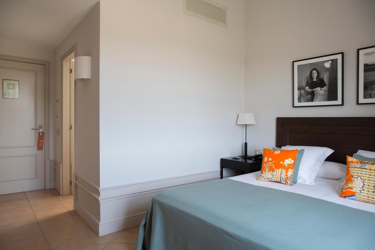 Cama o camas de una habitación en Casa Anamaria Hotel