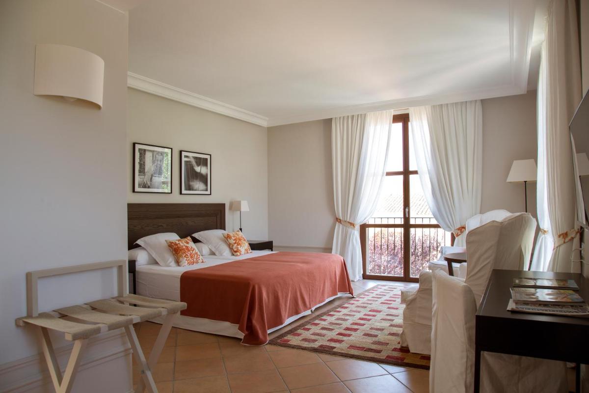 Cama o camas de una habitación en Casa Anamaria Hotel