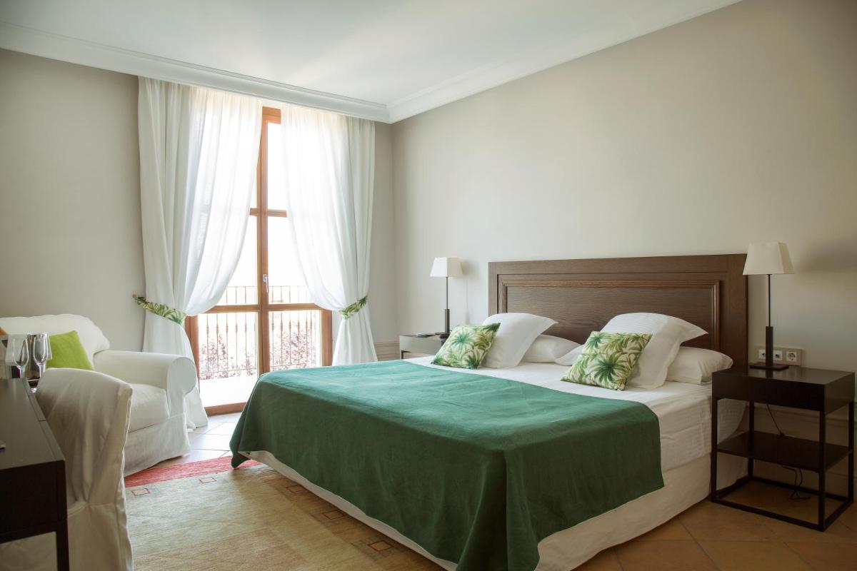 Cama o camas de una habitación en Casa Anamaria Hotel