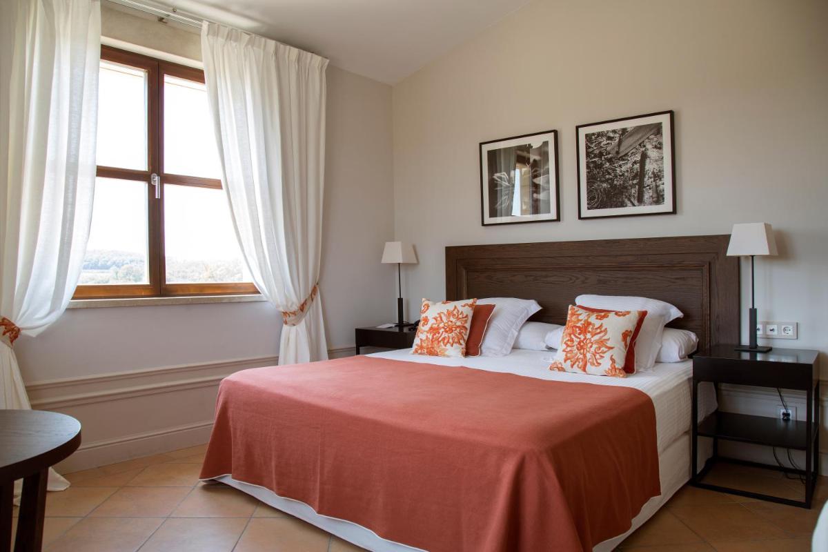 Cama o camas de una habitación en Casa Anamaria Hotel