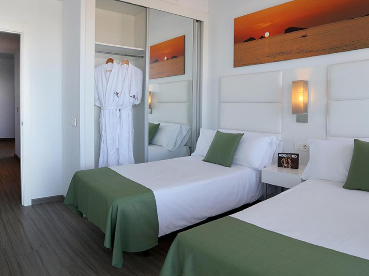 Cama o camas de una habitación en Axel Beach Ibiza - Adults Only