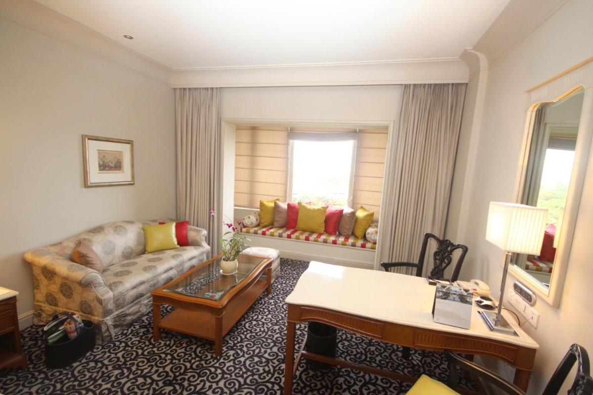 a living room with a couch and a table at Taj Bengal in Kolkata