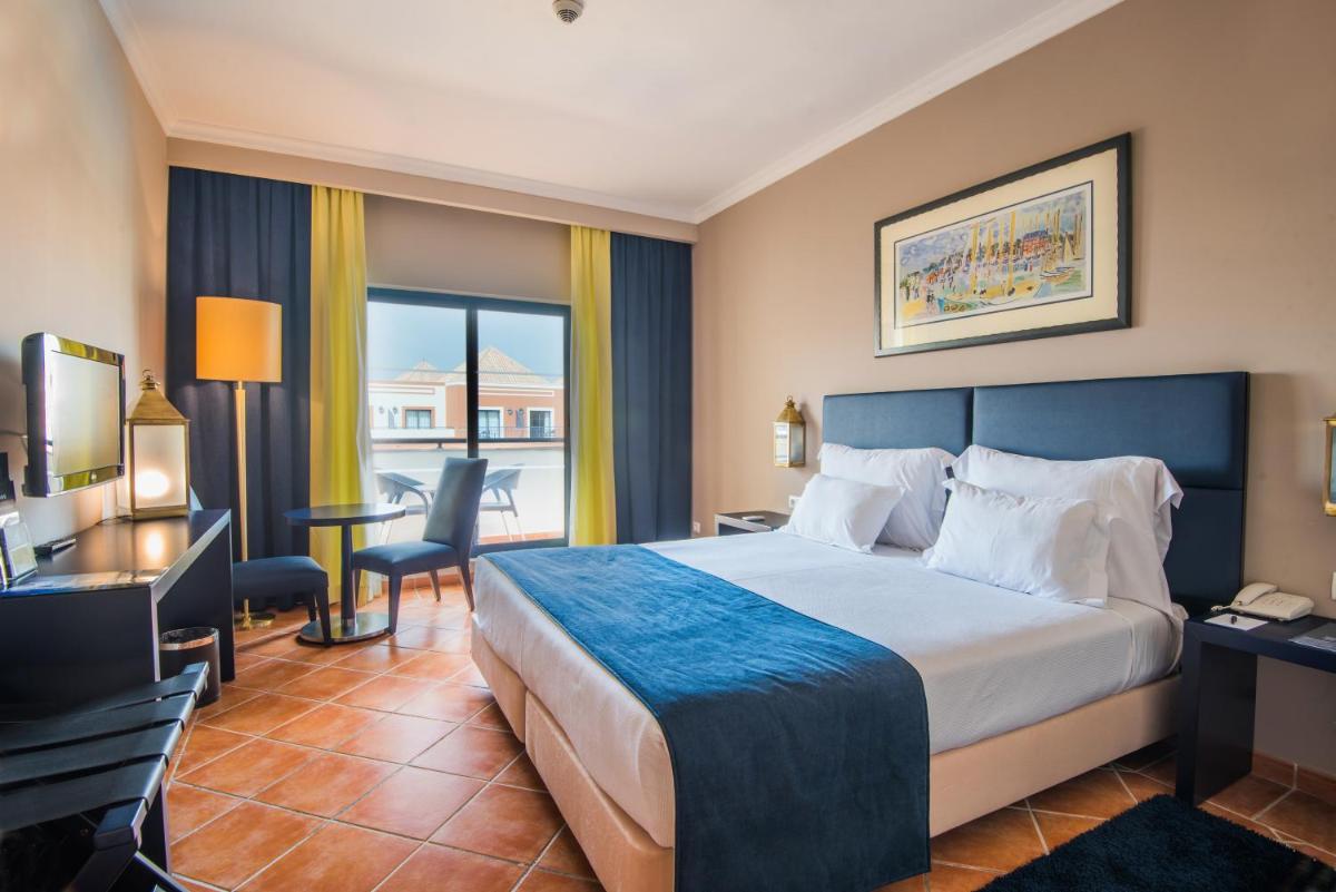 Uma cama ou camas num quarto em Vila Gale Tavira