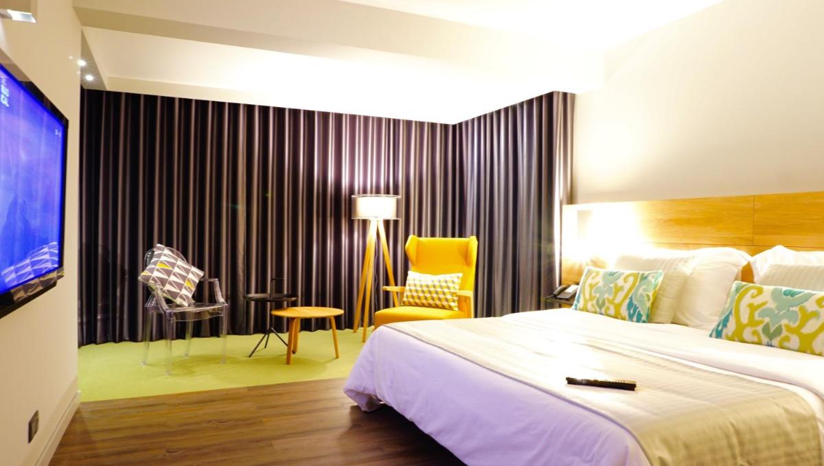 Uma cama ou camas num quarto em Madeira Panorâmico Hotel