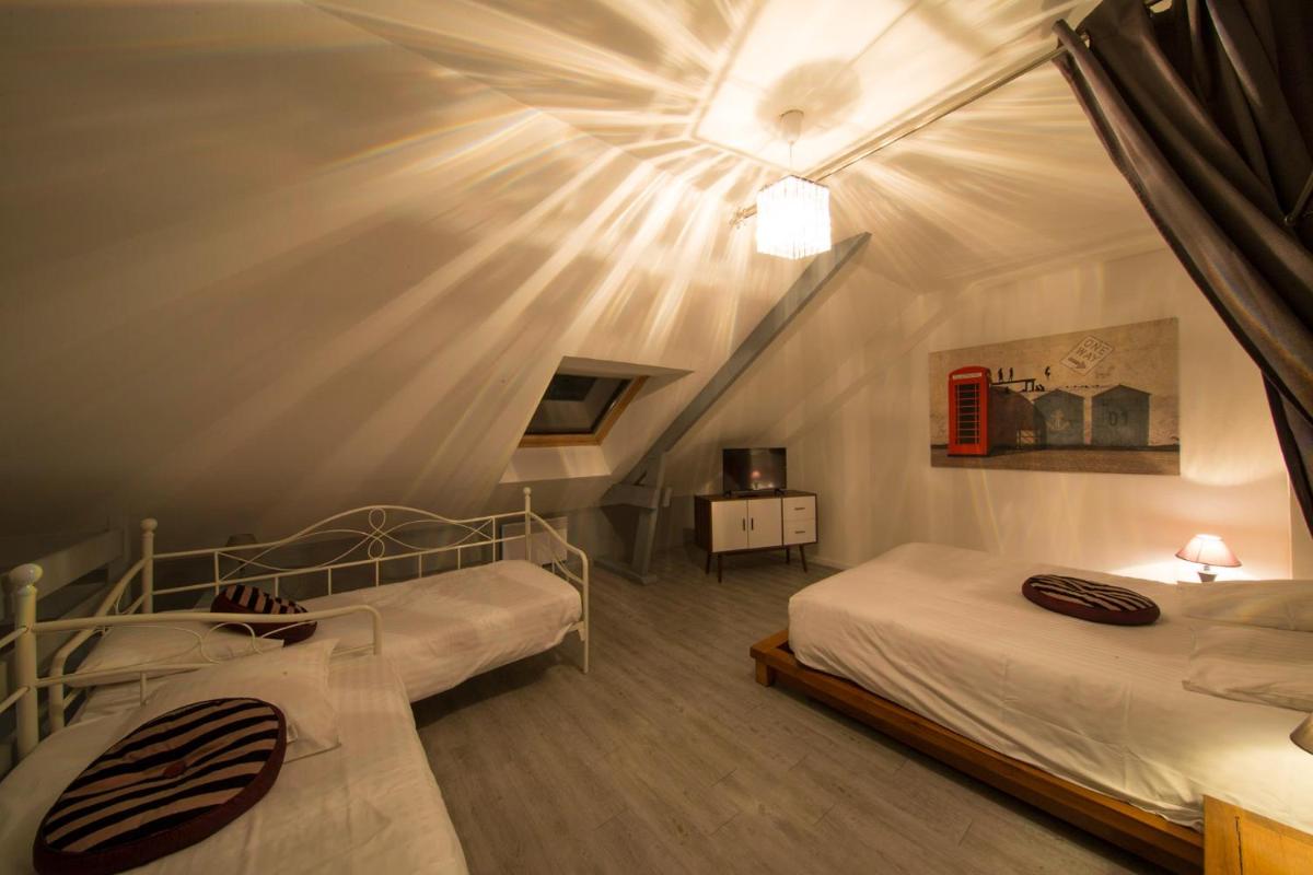 Un ou plusieurs lits dans un hébergement de l'établissement Les Terrasses de Saumur - Hôtel & Appartements - Restaurant & Spa (Logis)