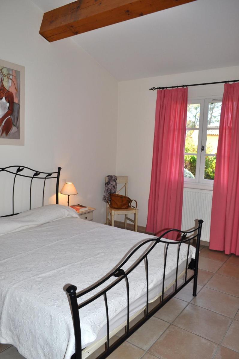 Un ou plusieurs lits dans un hébergement de l'établissement Les Appartements et Maisons du Domaine de Saint Endréol Golf & Spa Resort