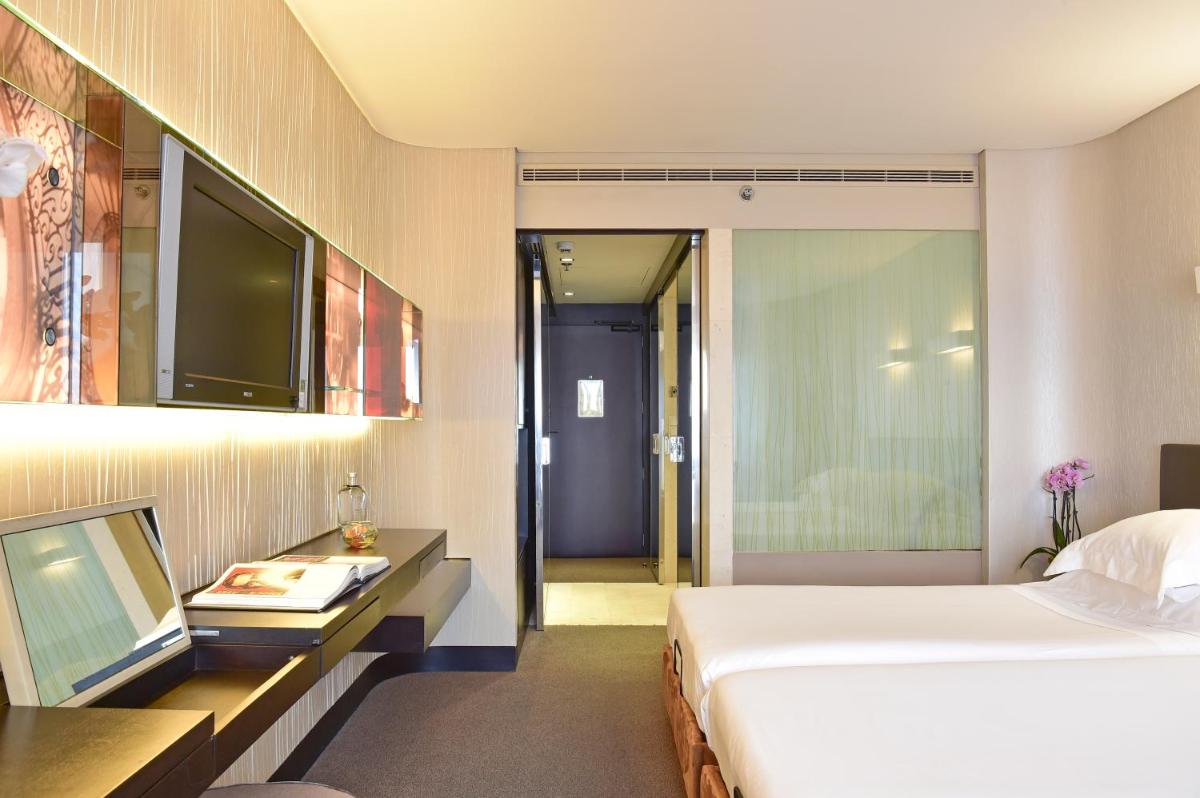 Uma cama ou camas num quarto em Porto Palácio Hotel by The Editory