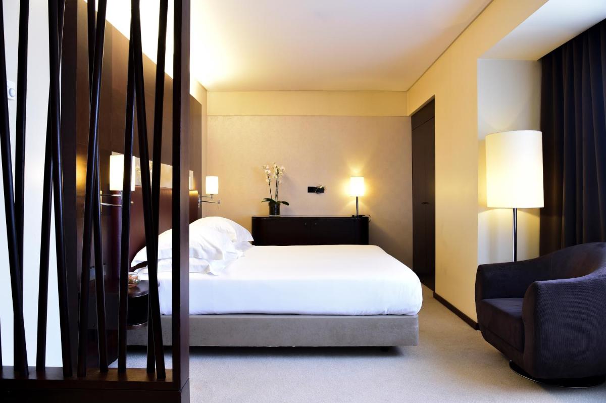 Uma cama ou camas num quarto em Porto Palácio Hotel by The Editory