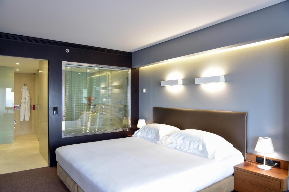 Uma cama ou camas num quarto em Porto Palácio Hotel by The Editory