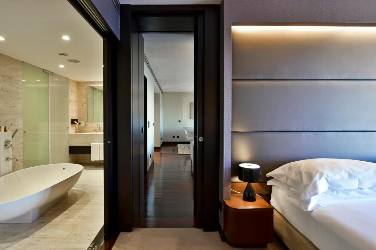 Uma cama ou camas num quarto em Porto Palácio Hotel by The Editory
