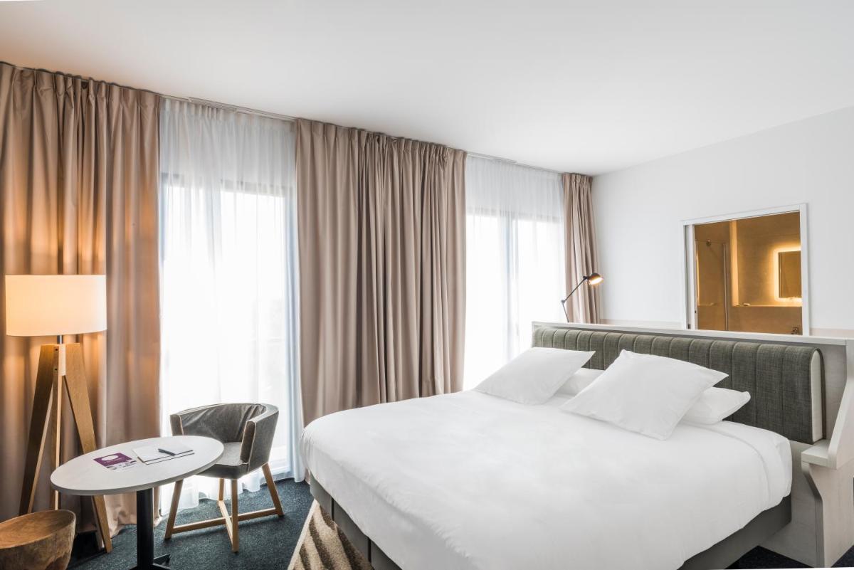 Un ou plusieurs lits dans un hébergement de l'établissement Mercure Hotel & Spa Bastia Biguglia