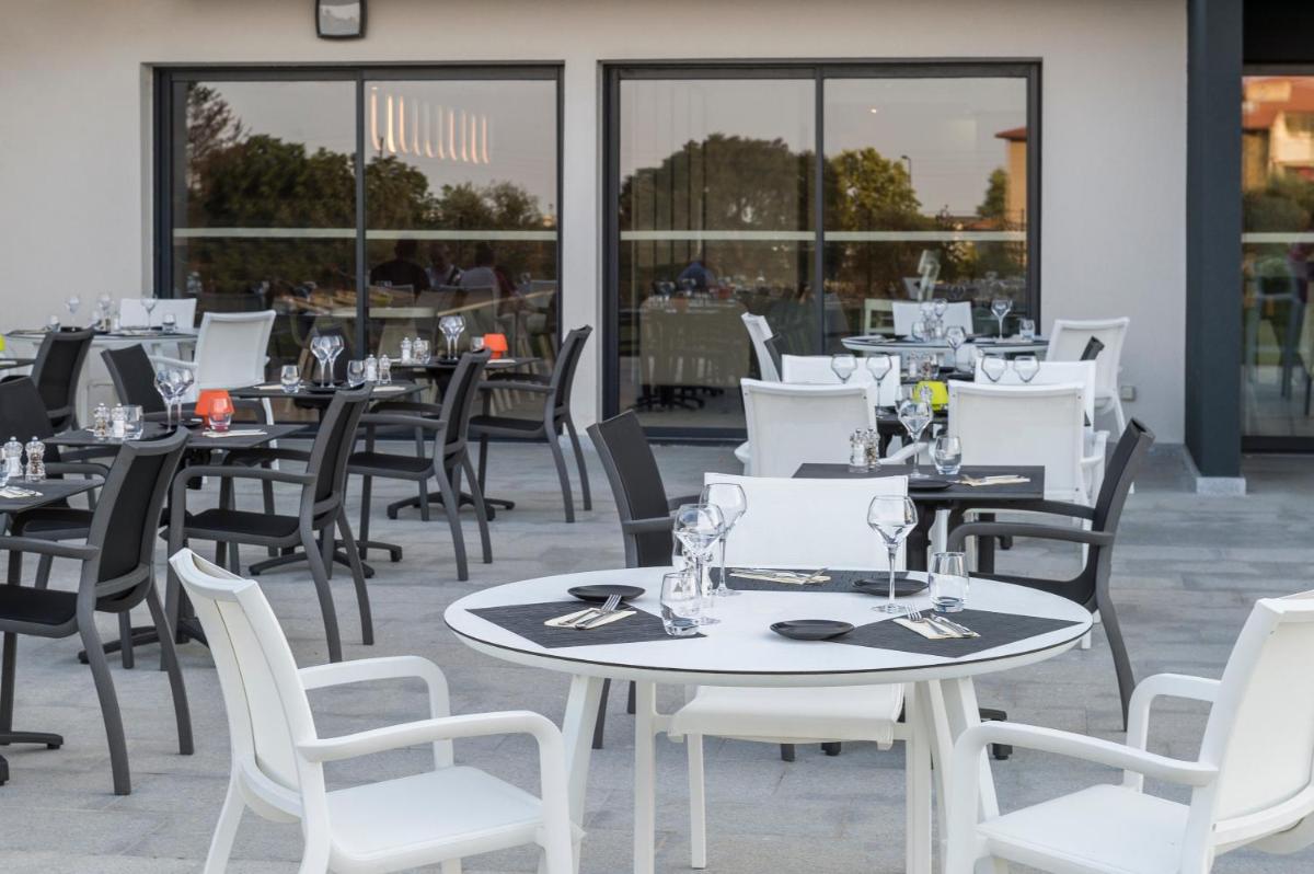Restaurant ou autre lieu de restauration dans l'établissement Mercure Hotel & Spa Bastia Biguglia