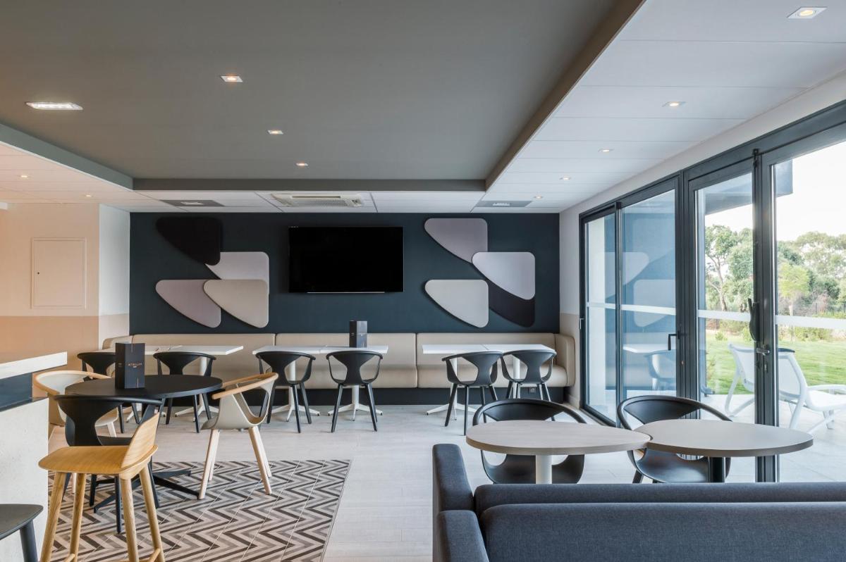 Coin salon dans l'établissement Mercure Hotel & Spa Bastia Biguglia