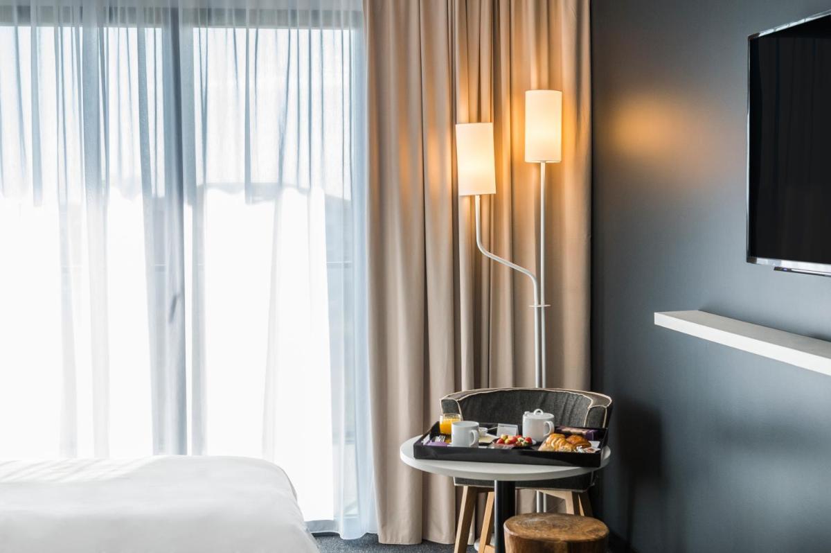 Un ou plusieurs lits dans un hébergement de l'établissement Mercure Hotel & Spa Bastia Biguglia