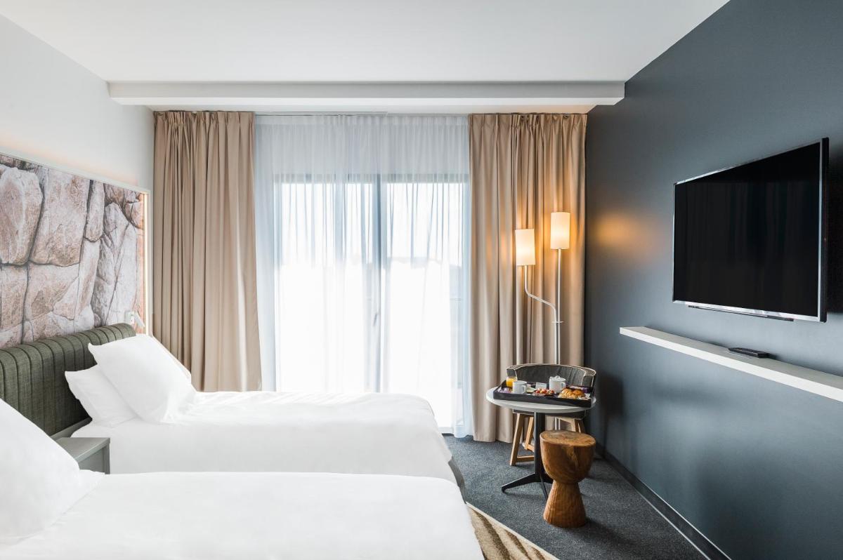 Un ou plusieurs lits dans un hébergement de l'établissement Mercure Hotel & Spa Bastia Biguglia