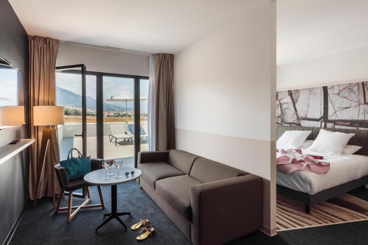 Un ou plusieurs lits dans un hébergement de l'établissement Mercure Hotel & Spa Bastia Biguglia