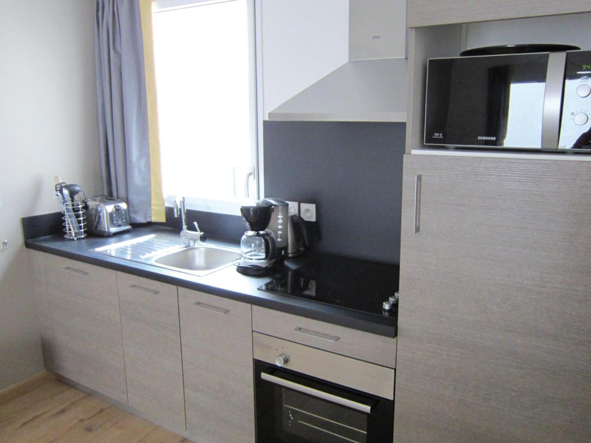 Cuisine ou kitchenette dans l'établissement Lagrange Vacances Les Patios Eugénie