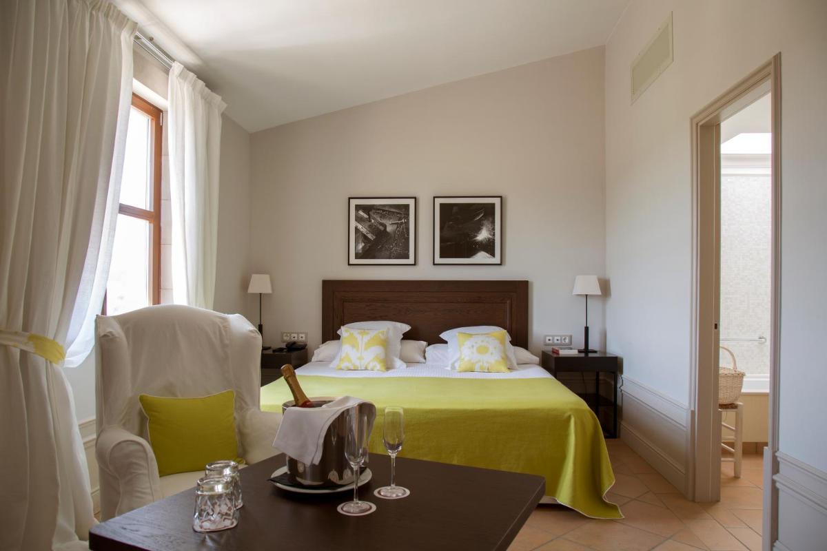 Cama o camas de una habitación en Casa Anamaria Hotel