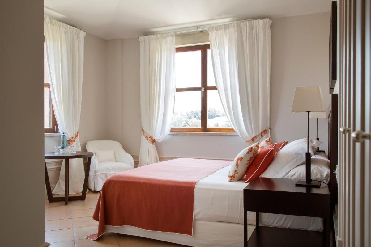 Cama o camas de una habitación en Casa Anamaria Hotel