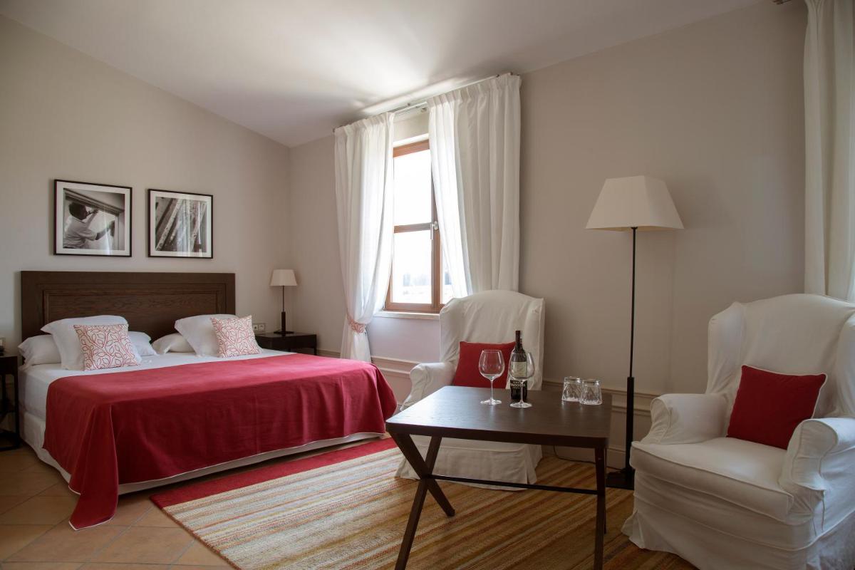 Cama o camas de una habitación en Casa Anamaria Hotel