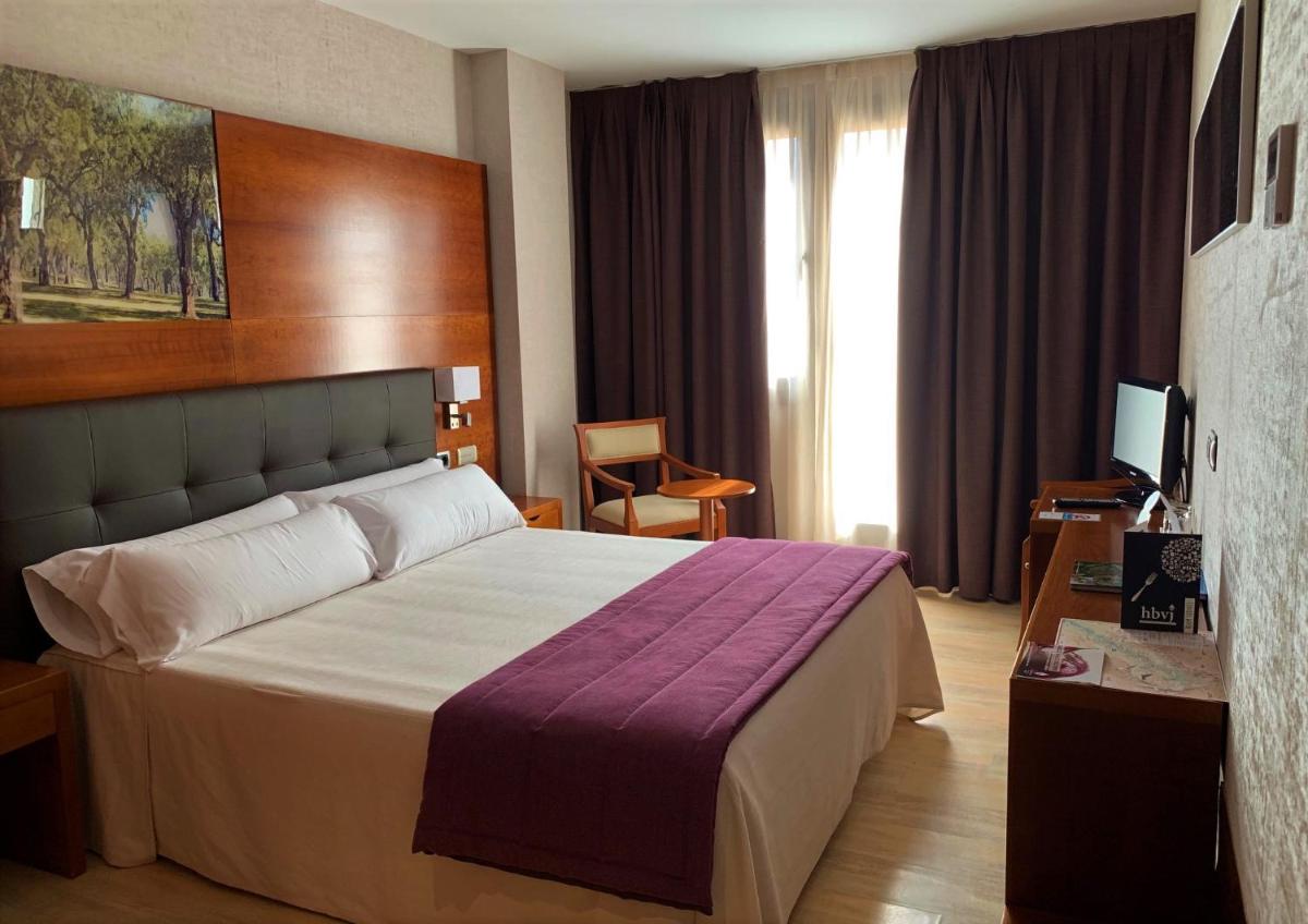 Cama o camas de una habitación en Hotel Balneario Valle del Jerte