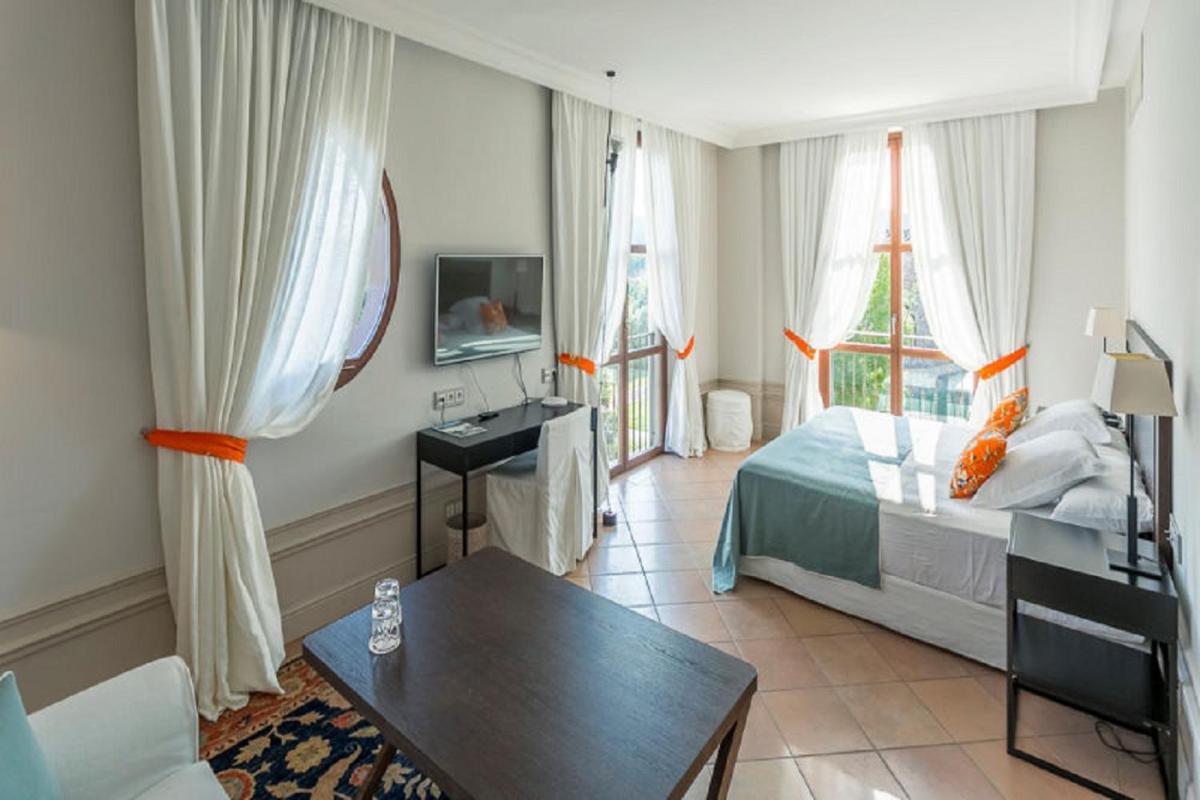 Cama o camas de una habitación en Casa Anamaria Hotel