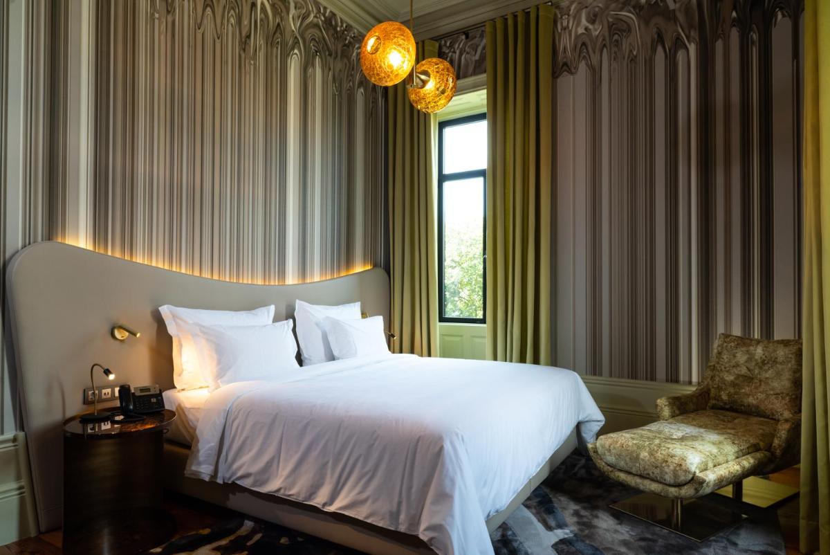 Uma cama ou camas num quarto em Vila Foz Hotel & SPA - member of Design Hotels