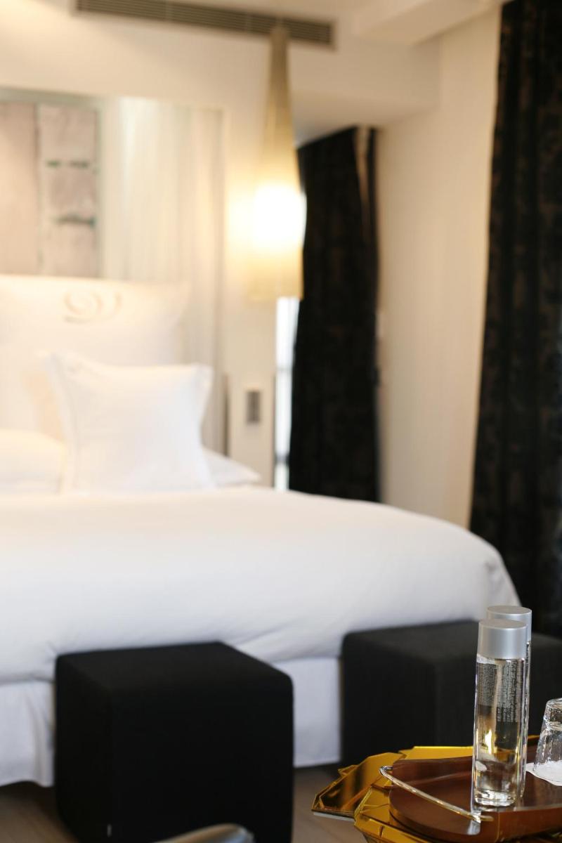 Un ou plusieurs lits dans un hébergement de l'établissement Domaine de Verchant & Spa - Relais & Châteaux