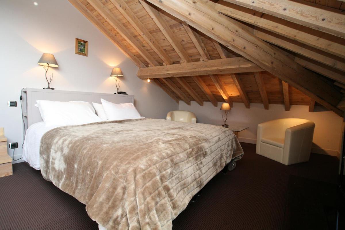 Un ou plusieurs lits dans un hébergement de l'établissement Hotel Corrieu