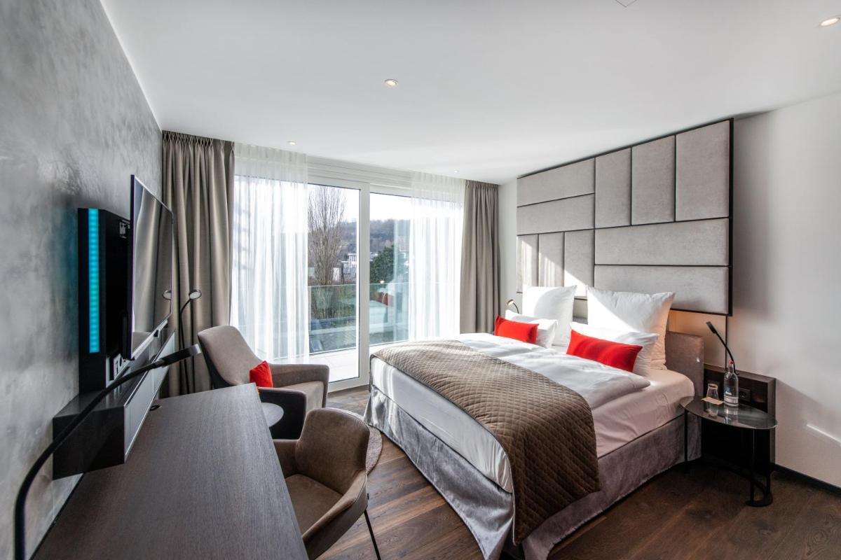 Ein Bett oder Betten in einem Zimmer der Unterkunft FÄHRHAUS Koblenz
