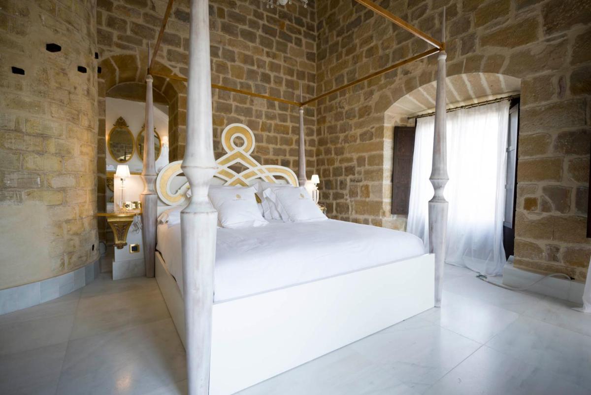Cama o camas de una habitación en Hotel Palacio De Úbeda 5 G.L