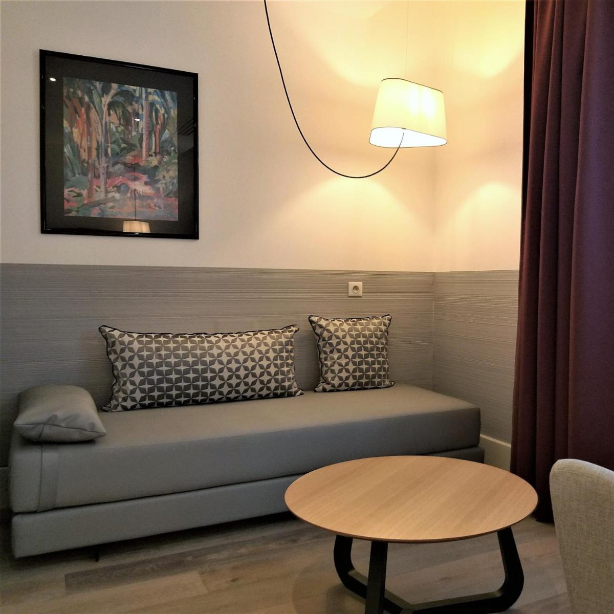 Coin salon dans l'établissement Hôtel Ginkgo - SPA Biloba