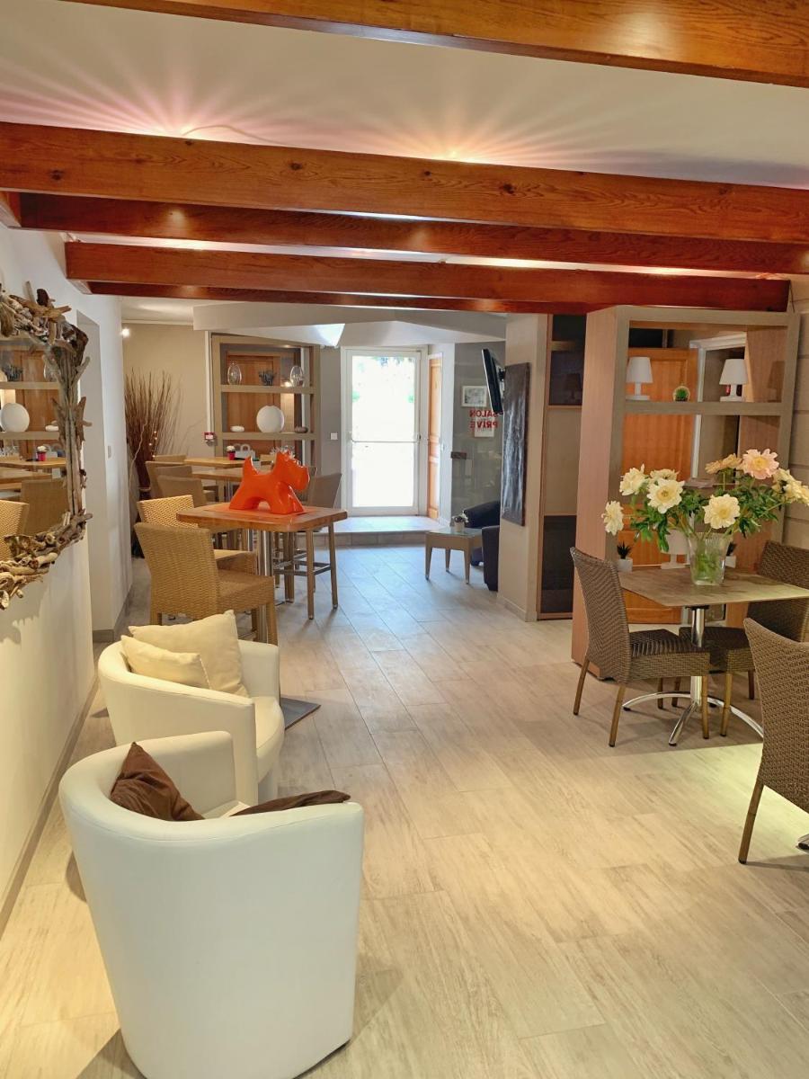 Coin salon dans l'établissement Hôtel Beau Soleil