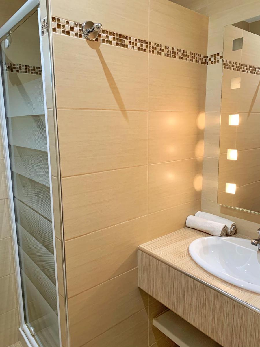 Salle de bains dans l'établissement Hôtel Beau Soleil