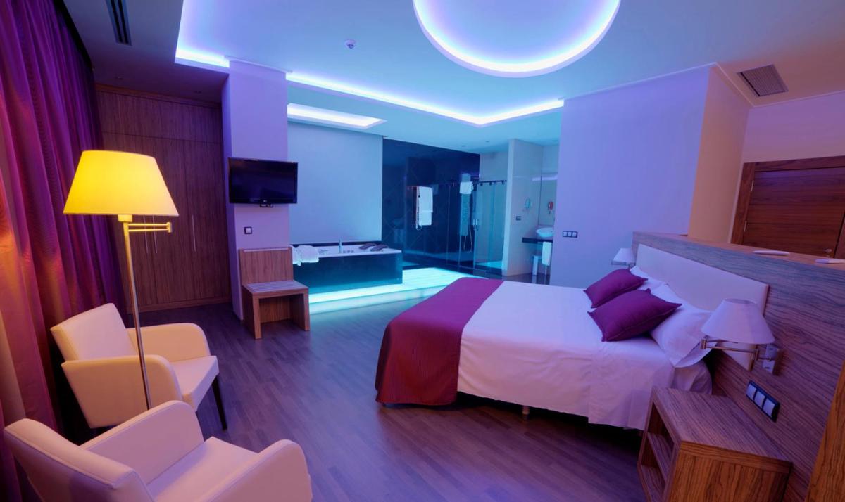 Cama o camas de una habitación en Dña Monse Hotel Spa & Golf