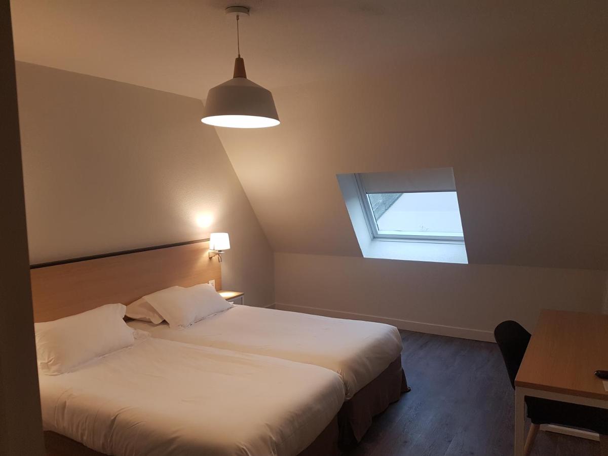 Un ou plusieurs lits dans un hébergement de l'établissement Best Western Armor Park Dinan et Spa