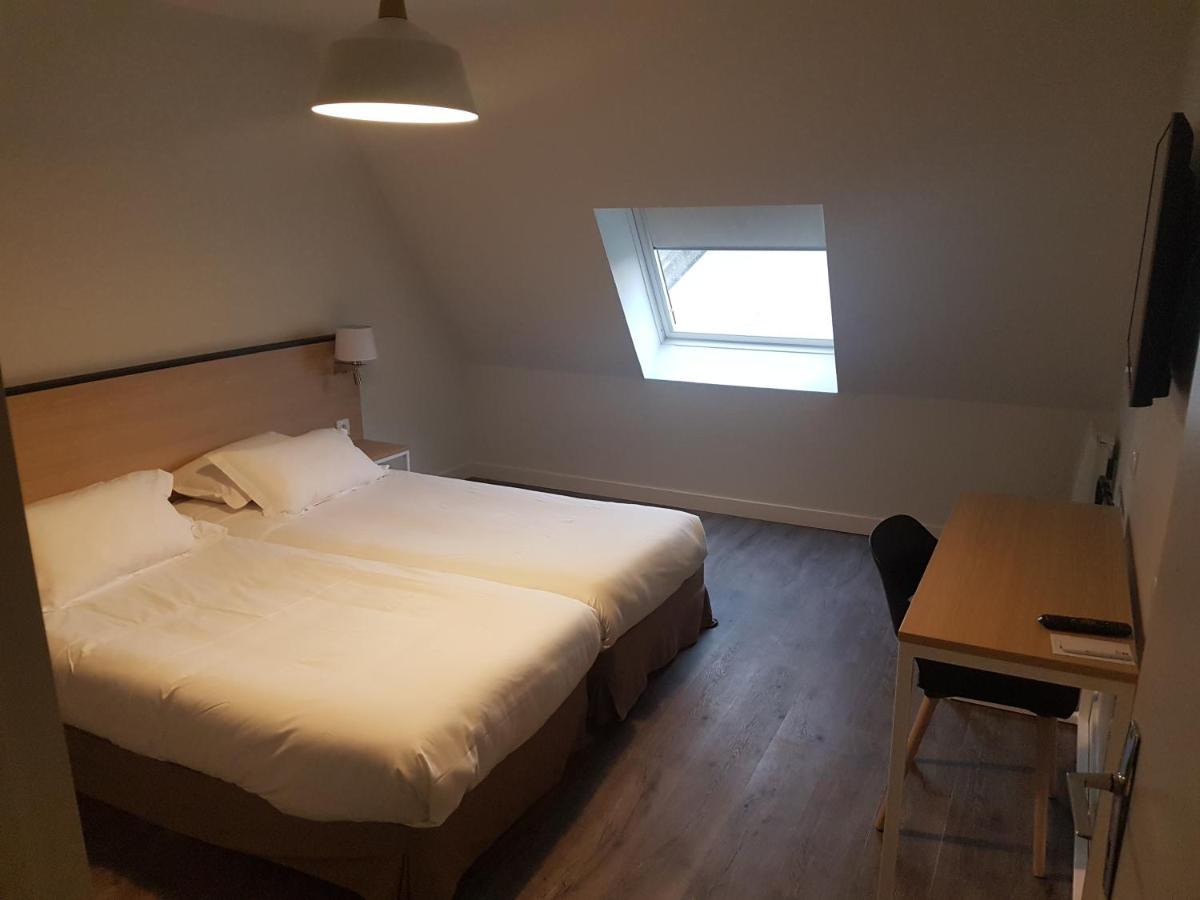 Un ou plusieurs lits dans un hébergement de l'établissement Best Western Armor Park Dinan et Spa