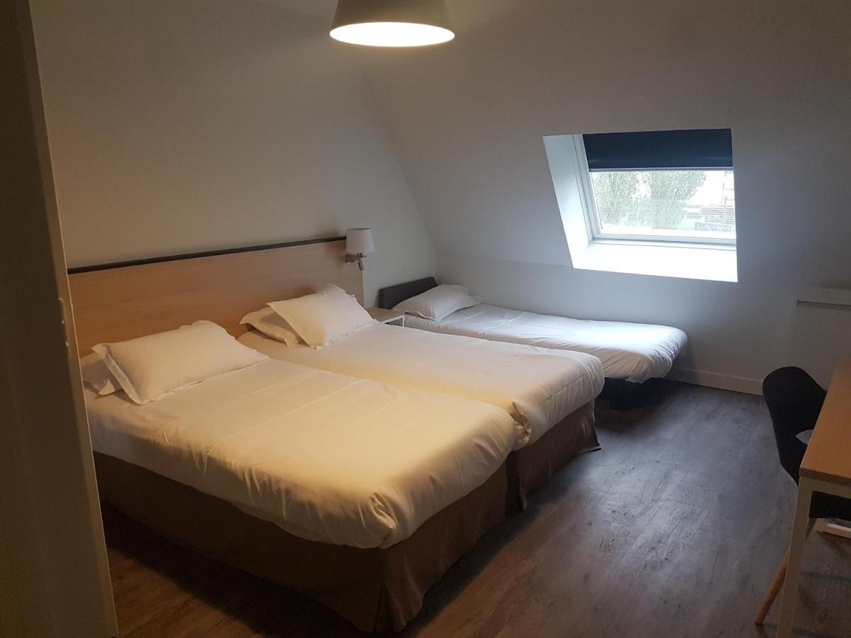 Un ou plusieurs lits dans un hébergement de l'établissement Best Western Armor Park Dinan et Spa