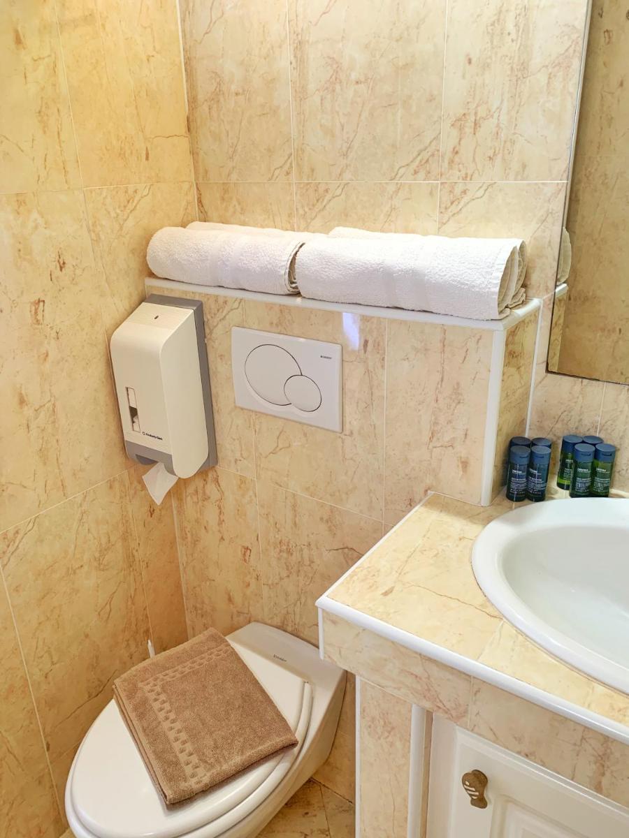 Salle de bains dans l'établissement Hôtel Beau Soleil