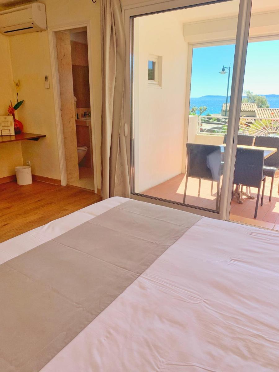 Un ou plusieurs lits dans un hébergement de l'établissement Hôtel Beau Soleil