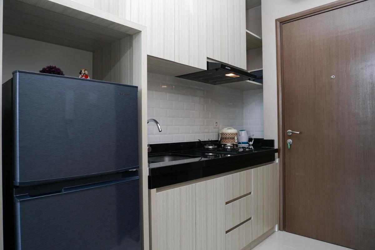 Comfy Studio Ciputra International Apartment By Travelio - Housity