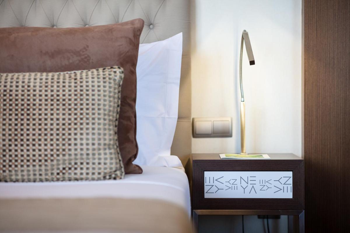 Uma cama ou camas num quarto em NEYA Lisboa Hotel