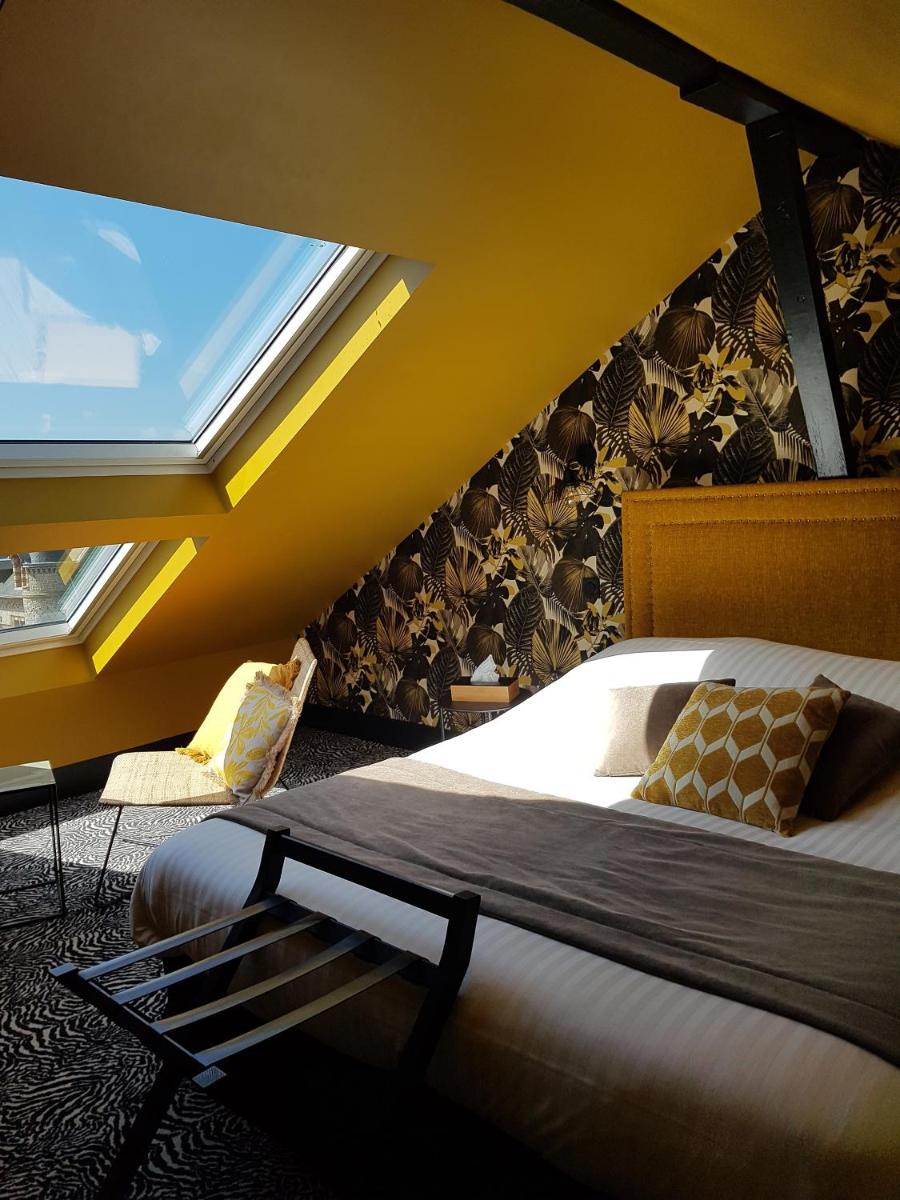 Un ou plusieurs lits dans un hébergement de l'établissement La villa 10 HÔTEL SPA