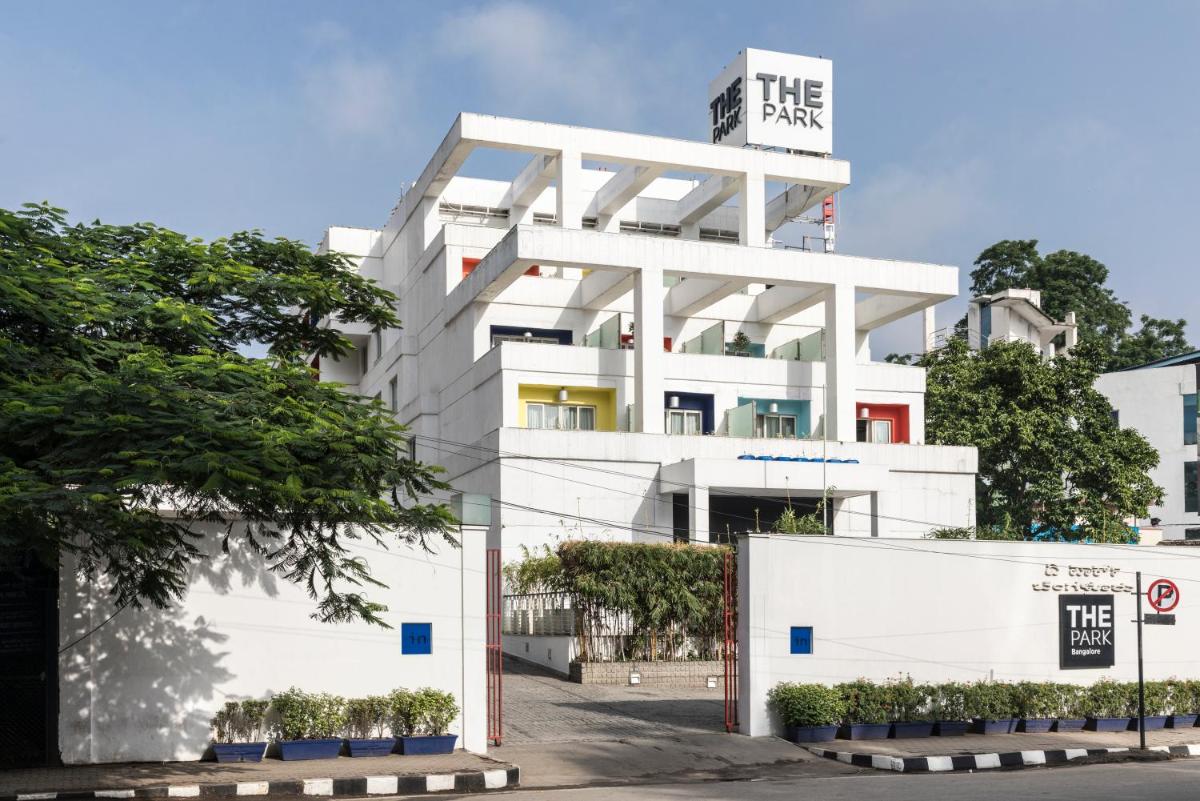 a white building with a sign on top of it at The Park Bangalore, MG Road in Bengaluru a white building with a sign on top of it at The Park Bangalore, MG Road in Bengaluru