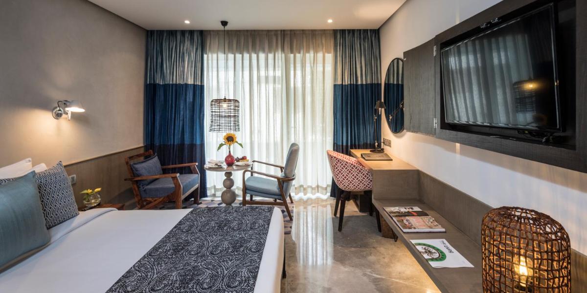 a hotel room with a bed and a desk at The Park Bangalore, MG Road in Bengaluru a hotel room with a bed and a desk at The Park Bangalore, MG Road in Bengaluru